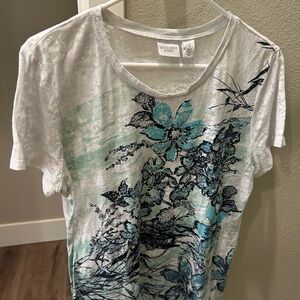 Chicos size 1 blouses in various colors.